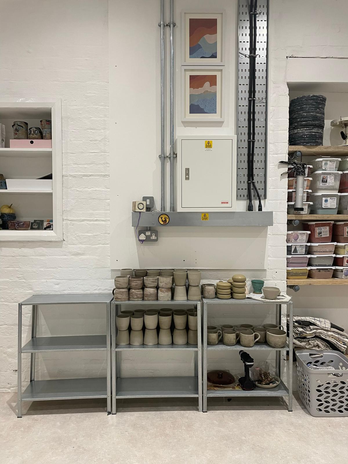 Shelves with pottery drying out