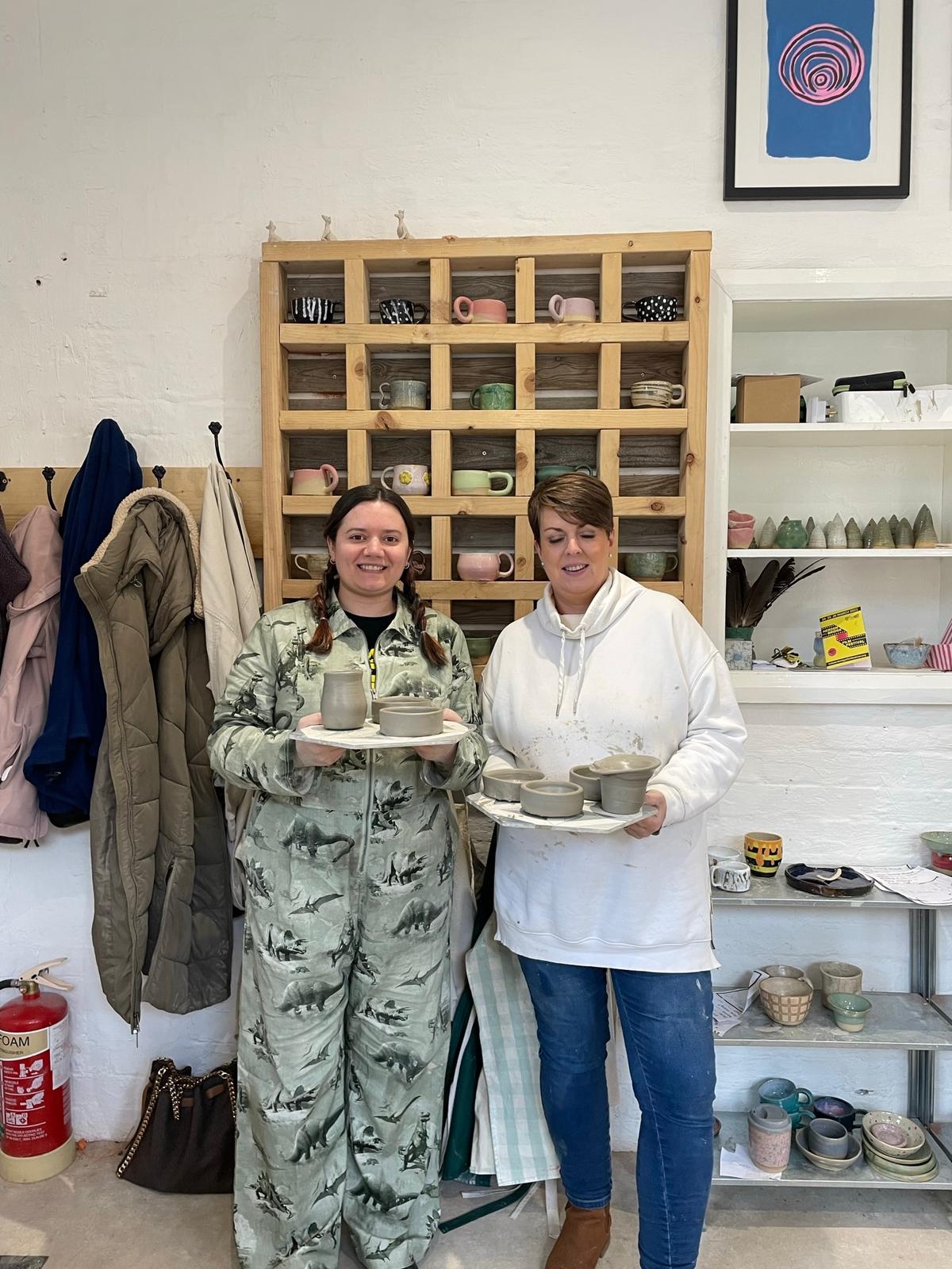 Students finishing their pottery class 