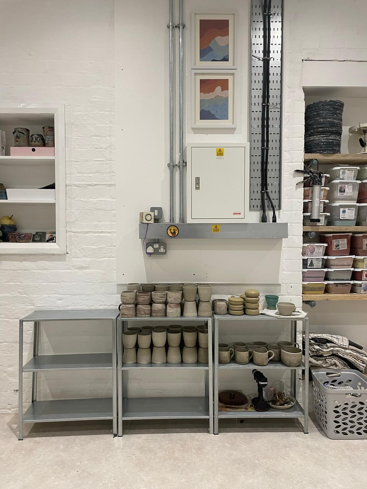 Shelves with pottery drying out 